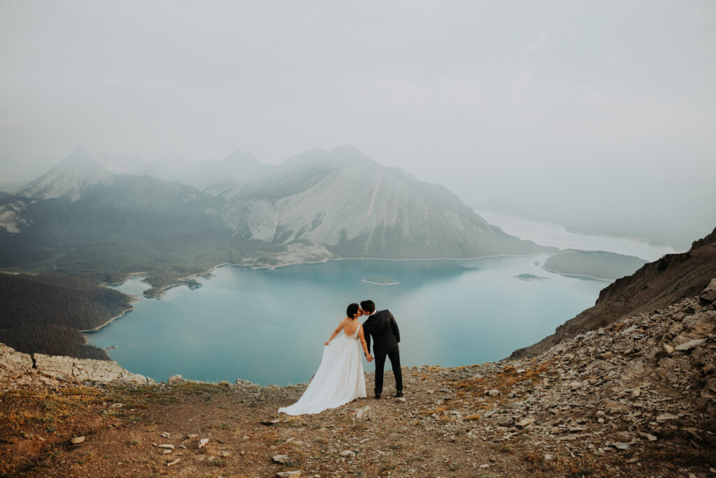 couple kissing on a mountainside during their Kananaskis elopement